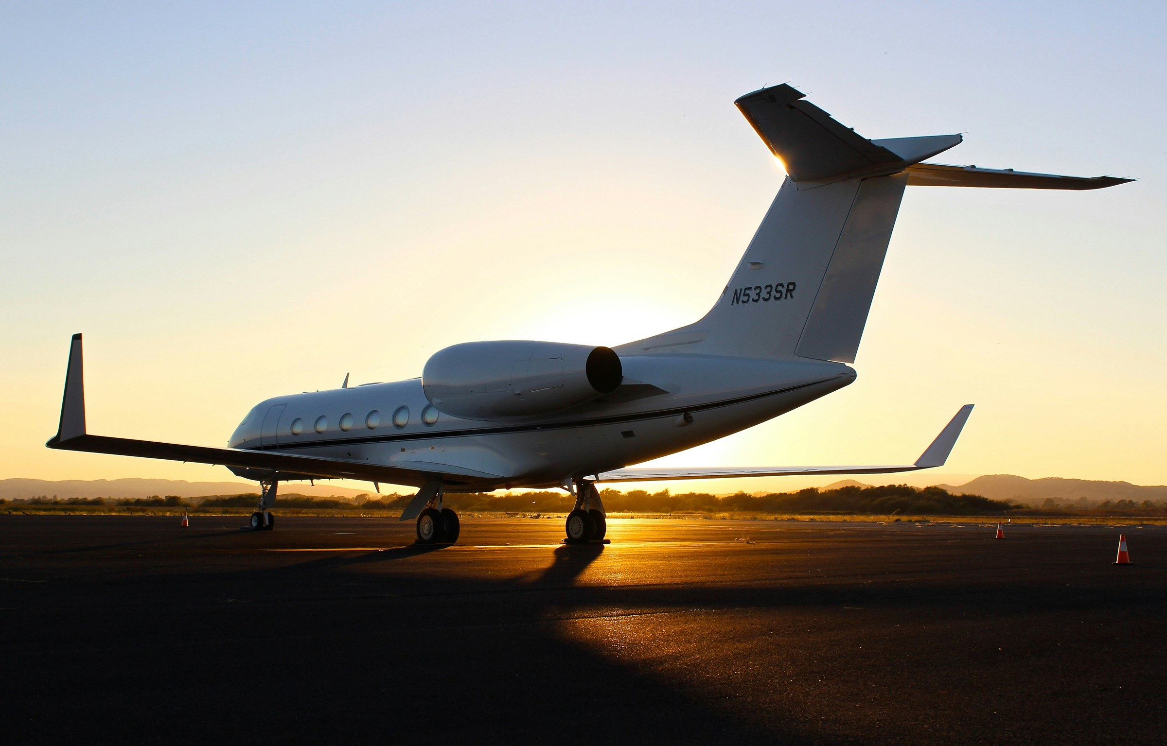 Corporate jet on the ramp at sunset